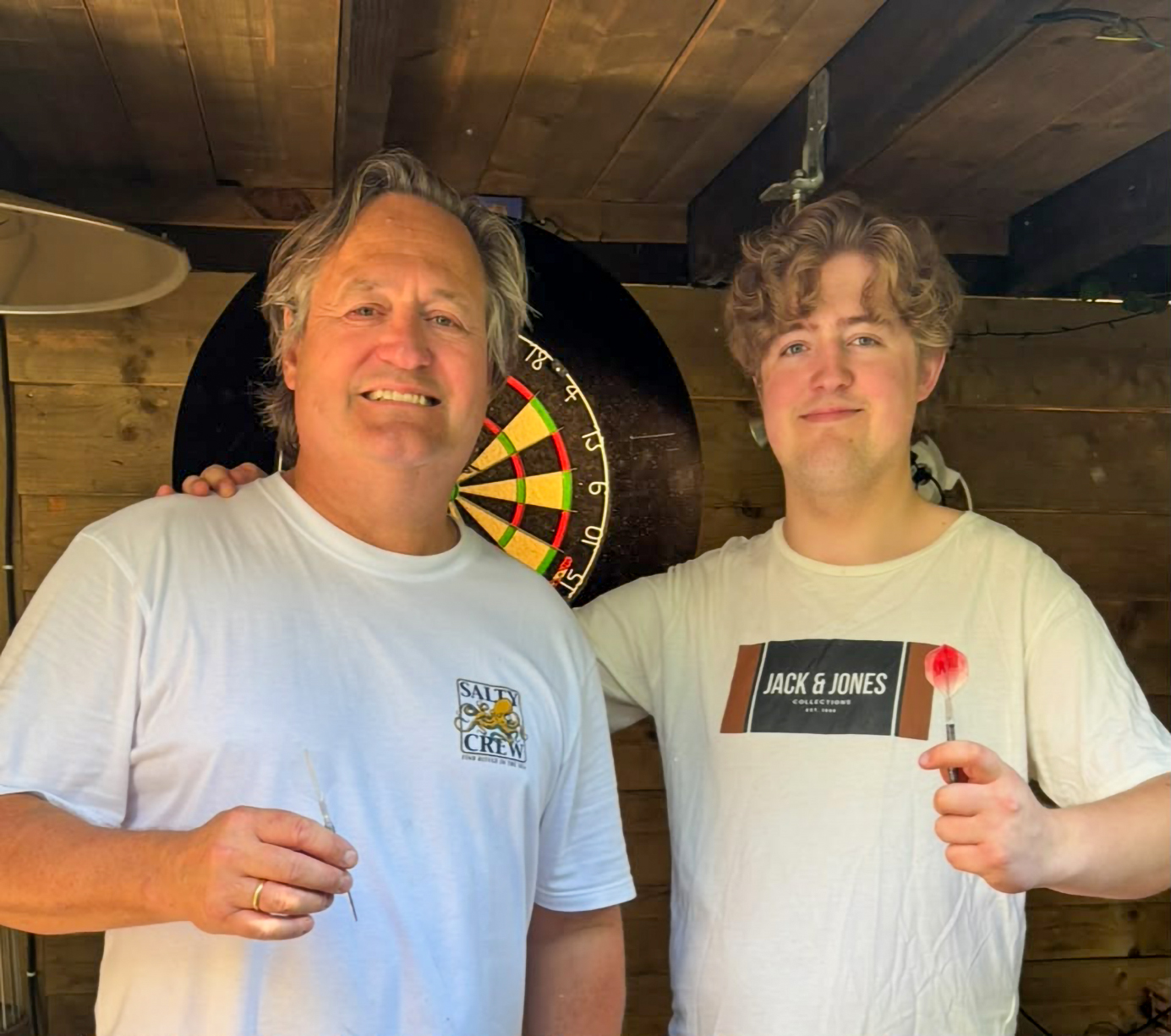 Floris playing darts with his father